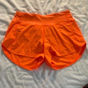Size 4 tall highlight orange Lululemon shorts